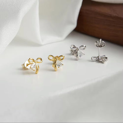 Golden Grace Bow Stud Earrings - Rhodium Plated